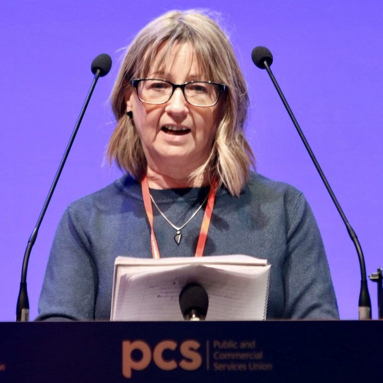 A picture of Ginnette Gantschuk speaking at PCS Conference